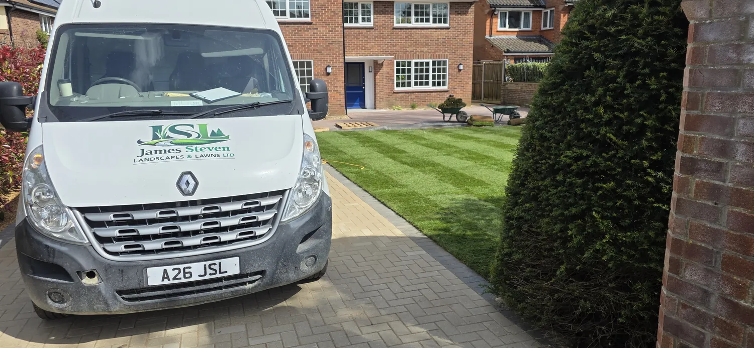 James Steven Landscapes & Lawns van beside a freshly laid lawn in Norwich