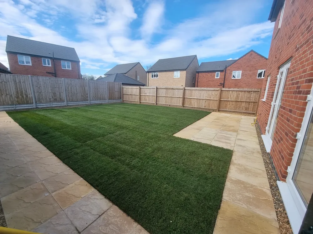 New turf laid between paving in a new-build garden in Norfolk